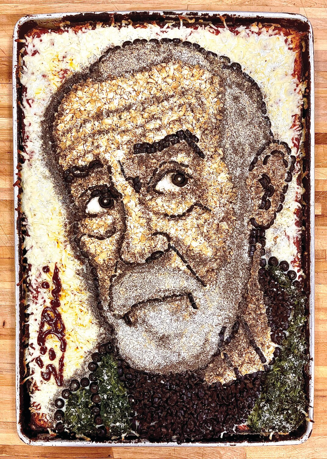 PIZZA ART: Eric Palmieri crafts portraits with pizza. He’s tackled an array of subjects from action star Sylvester Stallone to late comedian George Carlin, to pizza reviewer and Barstool Sports magnate Dave Portnoy.